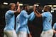MANCHESTER, ENGLAND - MARCH 25: Yaya Toure of Manchester City celebrates scoring the third goal with his team-mates Fernandinho and Vincent Kompany (L) during the Barclays Premier League match between Manchester United and Manchester City at Old Trafford on March 25, 2014 in Manchester, England. (Photo by Alex Livesey/Getty Images)