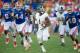 GAINESVILLE, FL - NOVEMBER 23: Quarterback Jerick McKinnon #1 of the Georgia Southern Eagles runs the ball through traffic for a first down during their game against the Florida Gators on November 23, 2013 at Ben Hill Griffin Stadium in Gainesville, Florida. Georgia Southern defeated Florida 26-20 (Photo by Michael Chang/Getty Images)