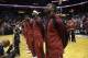 Miami Heat's Chris Bosh, left, LeBron James, center, and Dwyane Wade, right, stand for the national anthem before an NBA basketball game against the Sacramento Kings, Friday, Dec. 20, 2013, in Miami. (AP Photo/Lynne Sladky)