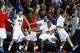 The SMU bench, including guard Keith Frazier (4), guard Sterling Brown (3) and center Cannen Cunningham (15), celebrates just before time expired in an NCAA college basketball game against California in the quarterfinals of the NIT, Wednesday, March 26, 2014, in Dallas. SMU won 67-65. (AP Photo/Sharon Ellman)