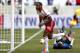 New York Red Bulls forward Thierry Henry, front, celebrates after scoring a goal on Colorado Rapids goalkeeper John Berner during the second half of an MLS soccer game, Saturday, March 15, 2014, in Harrison, N.J. The teams tied 1-1. (AP Photo/Julio Cortez)