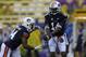 Auburn quarterback Nick Marshall (14) and running back Cameron Artis-Payne (44) warm up before an NCAA college football game against LSU in Baton Rouge, La., Saturday, Sept. 21, 2013. (AP Photo/Gerald Herbert)