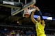 MILWAUKEE, WI - MARCH 22: Jordan Morgan #52 of the Michigan Wolverines dunks the ball against the Texas Longhorns during the third round of the 2014 NCAA Men's Basketball Tournament at BMO Harris Bradley Center on March 22, 2014 in Milwaukee, Wisconsin. (Photo by Mike McGinnis/Getty Images)