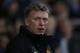 Manchester United's manager David Moyes looks on from the dugout before the start of their English Premier League soccer match against West Ham United at Upton Park, London, Saturday, March 22, 2014. (AP Photo/Sang Tan)