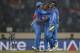 India's bowler Amit Mishra, center, celebrates with captain Mahendra Singh Dhoni, right, and teammate Rohit Sharma after taking the wicket of West Indies' batsman Dwayne Bravo during their ICC Twenty20 Cricket World Cup match in Dhaka, Bangladesh, Sunday, March 23, 2014. (AP Photo/Aijaz Rahi)