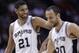 San Antonio Spurs' Tim Duncan (21) celebrates with Manu Ginobili (20) during the second half of an NBA basketball game against the Denver Nuggets, Wednesday, March 26, 2014, in San Antonio. San Antonio won 108-103. (AP Photo/Eric Gay)