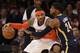 New York Knicks' Carmelo Anthony, left, tries to move around Indiana Pacers' Paul George during the first half of an NBA basketball game at Madison Square Garden on Wednesday, March 19, 2014, in New York. (AP Photo/Seth Wenig)