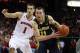 Jan 18, 2014; Madison, WI, USA; Michigan Wolverines guard Nik Stauskas (11) looks to shoot as Wisconsin Badgers guard Ben Brust (1) defends during the first half at the Kohl Center. Mandatory Credit: Mary Langenfeld-USA TODAY Sports