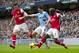 Manchester City's Samir Nasri, center, fights for the ball with Arsenal's Olivier Giroud, left, and Bacary Sagna during their English Premier League soccer match at the Etihad Stadium, Manchester, England, Saturday Dec. 14, 2013. (AP Photo/Jon Super)