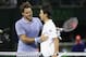 KEY BISCAYNE, FL - MARCH 26: Roger Federer of Switzerland at the net after his three set defeat congratulates Kei Nishikori of Japan during their quarter final round match during day 10 at the Sony Open at Crandon Park Tennis Center on March 26, 2014 in Key Biscayne, Florida. (Photo by Clive Brunskill/Getty Images)