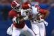 NEW ORLEANS, LA - JANUARY 02: Jalen Saunders #8 of the Oklahoma Sooners is tackled by Eddie Jackson #4 of the Alabama Crimson Tide during the Allstate Sugar Bowl at the Mercedes-Benz Superdome on January 2, 2014 in New Orleans, Louisiana. (Photo by Streeter Lecka/Getty Images)