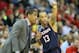 Mar 15, 2014; Memphis, TN, USA; Connecticut Huskies head coach Kevin Ollie talks to guard Shabazz Napier (13) during the first half against the Louisville Cardinals in final of the American Athletic Conference college basketball tournament at FedEx Forum. Mandatory Credit: Nelson Chenault-USA TODAY Sports