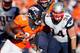 DENVER, CO - JANUARY 19: Montee Ball #28 of the Denver Broncos breaks a tackle against Chris Jones #94 of the New England Patriots during the AFC Championship game at Sports Authority Field at Mile High on January 19, 2014 in Denver, Colorado. (Photo by Kevin C. Cox/Getty Images)
