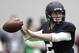 Texas A&M quarterback Johnny Manziel passes the ball during a drill at pro day for NFL football representatives in College Station, Texas, Thursday, March 27, 2014. (AP Photo/Patric Schneider)