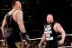Brock and Undertaker stare each other down.