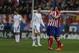 Atletico's Gabi, centre, celebrates his goal with teammate Filipe Luis, right, next to Real's Cristiano Ronaldo, second left, during a Spanish La Liga soccer match between Atletico de Madrid and Real Madrid at the Vicente Calderon stadium in Madrid, Spain, Sunday, March 2, 2014. (AP Photo/Andres Kudacki)
