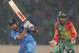 DHAKA, BANGLADESH - MARCH 28: Virat Kohli of India bats as Mushfiqur Rahim of Bangladesh looks on during the ICC World Twenty20 Bangladesh 2014 match between Bangladesh and India at Sher-e-Bangla Mirpur Stadium on March 28, 2014 in Dhaka, Bangladesh. (Photo by Scott Barbour/Getty Images)