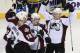 Colorado Avalanche left wing Gabriel Landeskog, left, of Sweden, celebrates with Patrick Bordeleau (58), Matt Duchene (9), and Paul Stastny (26) after Landeskog scored the winning goal against the Nashville Predators during a shootout at an NHL hockey game on Tuesday, March 25, 2014, in Nashville, Tenn. The Avalanche won the shootout to win the game 5-4. (AP Photo/Mark Zaleski)