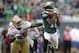 Philadelphia Eagles wide receiver DeSean Jackson (10) catches a pass as he is covered by San Francisco 49ers cornerback Tarell Brown (25) in the second half of an NFL football game Sunday, Oct. 2, 2011 in Philadelphia. (AP Photo/Julio Cortez)