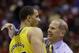 Michigan head coach John Beilein celebrates with Jordan Morgan (52) after an NCAA Midwest Regional semifinal college basketball tournament game against the Tennessee Friday, March 28, 2014, in Indianapolis. Michigan won 73-71.(AP Photo/David J. Phillip)