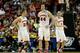 ANAHEIM, CA - MARCH 27: Josh Gasser #21, Frank Kaminsky #44 and Ben Brust #1 of the Wisconsin Badgers celebrate in the second half while taking on the Baylor Bears during the regional semifinal of the 2014 NCAA Men's Basketball Tournament at the Honda Center on March 27, 2014 in Anaheim, California. (Photo by Harry How/Getty Images)