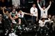 Michigan State players react during second half in a regional semifinal against Virginia at the NCAA men's college basketball tournament, early Saturday, March 29, 2014, in New York. (AP Photo/Julio Cortez)
