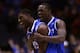 INDIANAPOLIS, IN - MARCH 28: Alex Poythress #22 and Julius Randle #30 of the Kentucky Wildcats celebrate defeating the Louisville Cardinals 74 to 69 during the regional semifinal of the 2014 NCAA Men's Basketball Tournament at Lucas Oil Stadium on March 28, 2014 in Indianapolis, Indiana. (Photo by Jonathan Daniel/Getty Images)