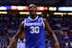 INDIANAPOLIS, IN - MARCH 28: Julius Randle #30 of the Kentucky Wildcats celebrates defeating the Louisville Cardinals 74 to 69 during the regional semifinal of the 2014 NCAA Men's Basketball Tournament at Lucas Oil Stadium on March 28, 2014 in Indianapolis, Indiana. (Photo by Andy Lyons/Getty Images)