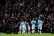 Manchester City's Fernandinho, left, fights for the ball against Arsenal's Jack Wilshere during their English Premier League soccer match at the Etihad Stadium, Manchester, England, Saturday Dec. 14, 2013. (AP Photo/Jon Super)