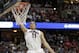 Arizona forward Aaron Gordon (11) dunks as San Diego State forward Matt Shrigley (40) watches during the second half in a regional semifinal of the NCAA men's college basketball tournament, Thursday, March 27, 2014, in Anaheim, Calif. (AP Photo/Jae C. Hong)