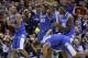 Kentucky's Andrew Harrison (5), Julius Randle (30), Alex Poythress (22) and Aaron Harrison (2) react to a call during the second half of an NCAA Midwest Regional semifinal college basketball tournament game against the Louisville Saturday, March 29, 2014, in Indianapolis. (AP Photo/David J. Phillip)