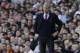 Arsenal's manager Arsene Wenger watches his team play from the technical area during the English Premier League soccer match between Tottenham Hotspur and Arsenal at White Hart Lane stadium in London, Sunday, March 16, 2014. (AP Photo/Matt Dunham)