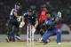 Sri Lankan wicket keeper Kumar Sangakkara, right, reacts as he fails to get the ball as New Zealand batsmen Andrew Ellis, center, and Luke Ronchi, left, run between the wickets during their second and final Twenty20 cricket match against Sri Lanka in Pallekele, Sri Lanka, Thursday, Nov. 21, 2013. The first match was abandoned due to rain. (AP Photo)