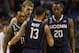 Connecticut guard Shabazz Napier (13) talks with Ryan Boatright (11), Niels Giffey (5) and Lasan Kromah (20) during the second half of a third-round game in the NCAA men's college basketball tournament in Buffalo, N.Y., Saturday, March 22, 2014. Connecticut defeated Villanova, 77-65. (AP Photo/Bill Wippert)