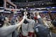 Players lift Wisconsin head coach Bo Ryan after a regional final NCAA college basketball tournament game against Arizona, Saturday, March 29, 2014, in Anaheim, Calif. Wisconsin won 64-63 in overtime. (AP Photo/Jae C. Hong)