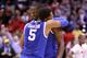 INDIANAPOLIS, IN - MARCH 28: Andrew Harrison #5 and Julius Randle #30 of the Kentucky Wildcats celebrate defeating the Louisville Cardinals 74 to 69 during the regional semifinal of the 2014 NCAA Men's Basketball Tournament at Lucas Oil Stadium on March 28, 2014 in Indianapolis, Indiana. (Photo by Andy Lyons/Getty Images)