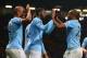 MANCHESTER, ENGLAND - MARCH 25: Yaya Toure of Manchester City celebrates scoring the third goal with his team-mates Fernandinho and Vincent Kompany (L) during the Barclays Premier League match between Manchester United and Manchester City at Old Trafford on March 25, 2014 in Manchester, England. (Photo by Alex Livesey/Getty Images)