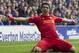 Liverpool's Luis Suarez celebrates after scoring against Everton, during their English Premier League soccer match at Goodison Park Stadium, Liverpool, England, Saturday Nov. 23, 2013. (AP Photo/Jon Super)