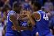 INDIANAPOLIS, IN - MARCH 30: Aaron Harrison #2 of the Kentucky Wildcats celebrates with teammates Julius Randle #30 and Dakari Johnson #44 after defeating the Michigan Wolverines 75 to 72 in the midwest regional final of the 2014 NCAA Men's Basketball Tournament at Lucas Oil Stadium on March 30, 2014 in Indianapolis, Indiana. (Photo by Jonathan Daniel/Getty Images)