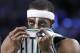 Boston Celtics guard Rajon Rondo (9) wipes his face with his jersey in the second half of an NBA basketball game against the Toronto Raptors in Boston, Wednesday, March 26, 2014. (AP Photo/Elise Amendola)