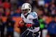 DENVER, CO - DECEMBER 8: Running back Chris Johnson #28 of the Tennessee Titans runs with the ball against the Denver Broncos at Sports Authority Field Field at Mile High on December 8, 2013 in Denver, Colorado. The Broncos defeated the Titans 51-28. (Photo by Justin Edmonds/Getty Images)