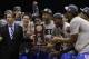 Kentucky head coach John Calipari, left, and players celebrate after an NCAA Midwest Regional final college basketball tournament game Sunday, March 30, 2014, in Indianapolis. Kentucky won 75-72 to advance to the Final Four. (AP Photo/Michael Conroy)
