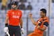 Netherlands's Mudassar Bukhari, right, celebrates the wicket of England's Michael Lumb, left, during their ICC Twenty20 Cricket World Cup match in Chittagong, Bangladesh, Monday, March 31, 2014. (AP Photo/A.M. Ahad)