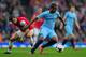 LONDON, ENGLAND - MARCH 29: Fernandinho of Manchester City and Mathieu Flamini of Arsenal compete for the ball during the Barclays Premier League match between Arsenal and Manchester City at Emirates Stadium on March 29, 2014 in London, England. (Photo by Shaun Botterill/Getty Images)