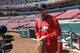 St. Louis Cardinals starting pitcher Adam Wainwright walks onto the field at the start of batting practice on Sunday, March 30, 2014, in Cincinnati. Wainwright will be the starting pitcher for the Cardinals in Monday's Opening Day baseball game against the Cincinnati Reds in Cincinnati. (AP Photo/Al Behrman)