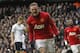 Manchester United's Wayne Rooney celebrates his penalty goal against Tottenham Hotspur during their English Premier League soccer match at White Hart Lane, London, Sunday, Dec. 1, 2013. (AP Photo/Sang Tan)
