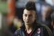 AC Milan forward Stephan El Shaarawy watches from the bench during a Serie A soccer match between AC Milan and Cagliari, at the San Siro stadium in Milan, Italy, Sunday, Sept.1, 2013. (AP Photo/Luca Bruno)