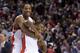 Toronto Raptors teammates DeMar DeRozan, left, and Kyle Lowry, right, celebrate after defeating the Atlanta Hawks 96-86 in an NBA basketball game in Toronto on Sunday, March 23, 2014. (AP Photo/The Canadian Press, Nathan Denette)
