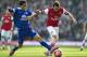 Arsenal's Santi Cazorla, right, fights for the ball with Everton's Steven Pienaar, during their FA Cup quarterfinal soccer match, at Emirates Stadium, in London, Saturday, March 8, 2014. (AP Photo/Bogdan Maran)