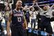 Connecticut's Shabazz Napier (13) celebrates after his team defeated Michigan State 60-54 in a regional final at the NCAA college basketball tournament, Sunday, March 30, 2014, in New York. Napier scored 17 points of his 25 points in the second half. (AP Photo/Frank Franklin II)